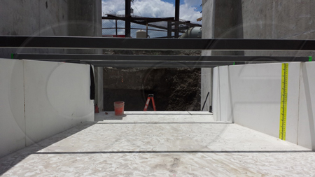 120-inch fiberglass Parshall flume manufactured by Openchannelflow undergoing installation