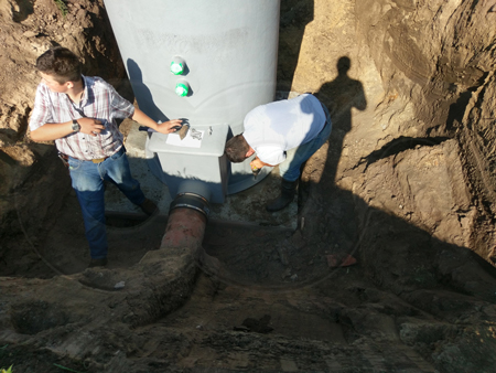 fernco coupling installed on a fiberglass packaged metering manhole