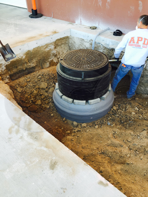 bringing the Packaged Metering Manhole installation up to grade thought the use of grade rings - frame - cover