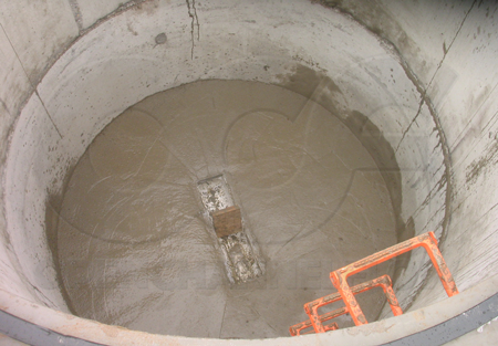 Bench poured around a Palmer-Bowlus flume as part of the installation process - debris in the flume should have been cleared out prior to this point