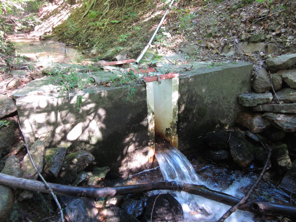 concrete wing walls on a Parshall flume measuring surface water flows