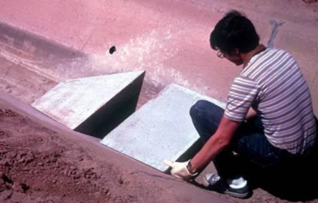Constructing a long-throated flume in a line irrigation canal