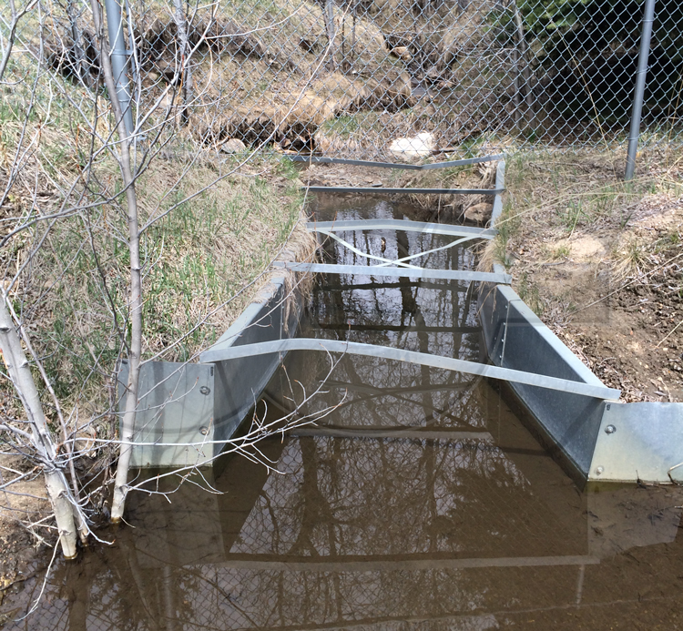 Distorted galvanized steel Parshall flume