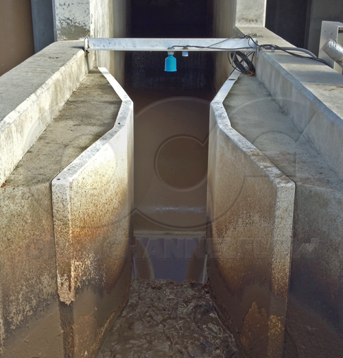 fiberglass Parshall flume measuring raw sanitary sewage at WWTP headworks