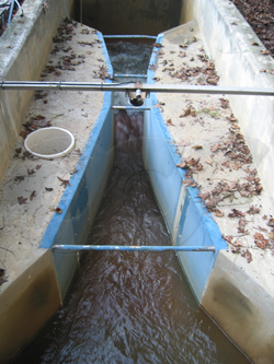 fiberglass Parshall flume installed in concrete channel 