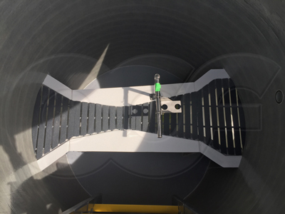 recessed fiberglass grating installed on a Parshall flume integrated into a fiberglass Packaged Metering Manhole - the grating is undergoing a fit test prior to the ultrasonic sensor beam cut-out being made