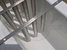 Close-up detail of Tranquilizer Racks being test fit into a Palmer-Bowlus Flume