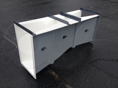 side view of a fiberglass 6-inch Parshall flume showing the drop through the flume - flow is from right to left