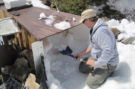 Removing snow from a fiberglass Parshall flume