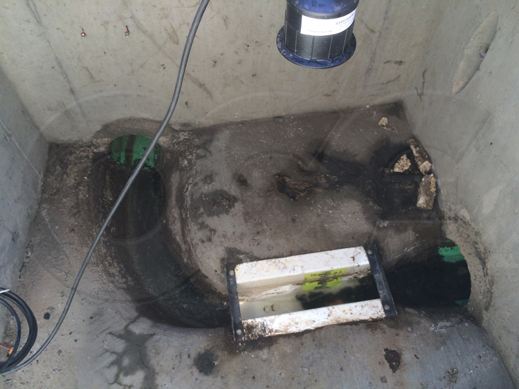 solids collecting upstream of a Palmer-Bowlus flume