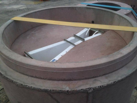 a fiberglass Parshall flume precast into a concrete flow sampling manhole