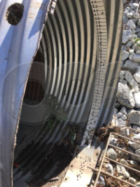 circular head gauge mounted in a round pipe