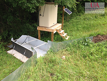 sheet metal walls used to direct flow into a h flume measuring edge-of-field flows