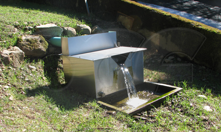 splash guard on a stainless steel weir box measuring dam seepage