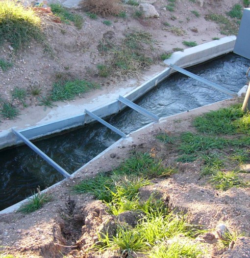submerged galvanized steel Parshall flume measuring irrigation flows