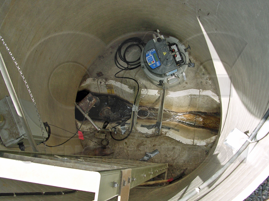 Trapezoidal flume in a fiberglass packaged flow metering manhole