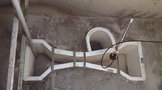 Wastewater fiberglass Parshall flume with end adapters, stilling well (not used), and ultrasonic sensor