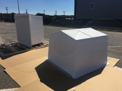 two custom fiberglass enclosures to drop over equipment pumps