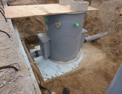 a properly sized concrete slab for a fiberglass packaged flow metering manhole