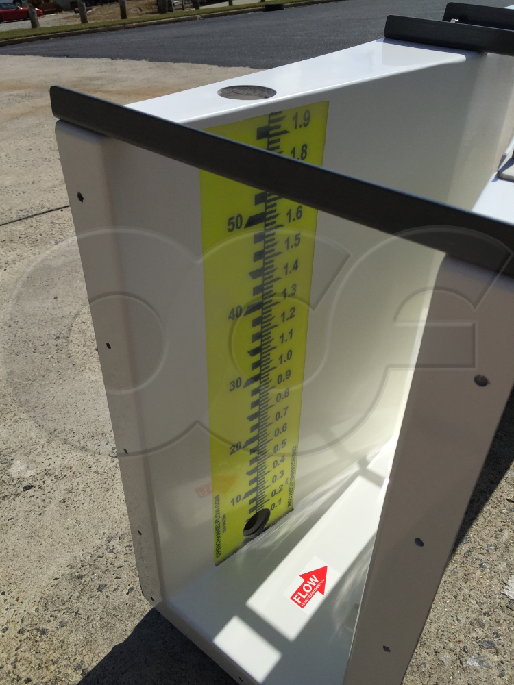 Close-Up View of a Probe Well and Staff Gauge on Same Wall