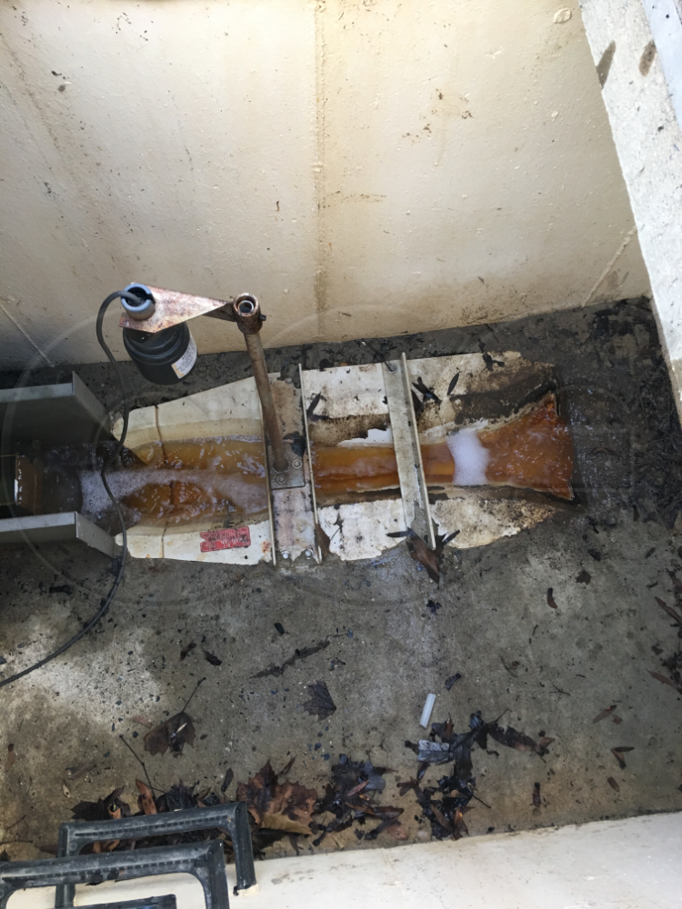 Trapezoidal Flume Experiencing Discharge Restriction