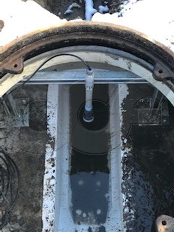 Ultrasonic Flow Meter Measuring Flow Through a Palmer-Bowlus in a Packaged Metering Manhole