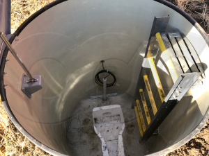 Interior View of an Industrial Discharge Flow Manhole with Domed Fiberglass Top