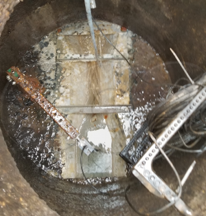 Extra Large Trapezoidal Flume Measuring Industrial Discharge in a Concrete Manhole