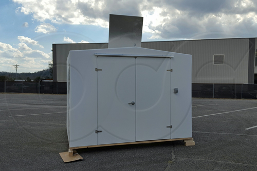 double door fiberglass buidling with an open roof hatch