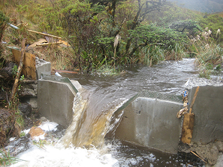 free-spilling discharge over a v-notch weir measuring a watershed