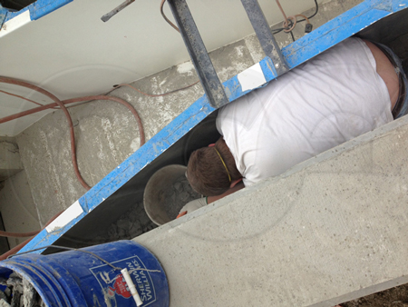 grouting the base of a parshall flume during an installation