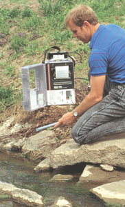 ISCO 4220 Submerged Probe being installed in a small stream