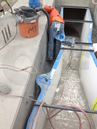 a roughed in channel for a parshall flume installation