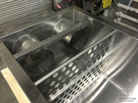 perforated weir box baffles downstream of pipe stubs